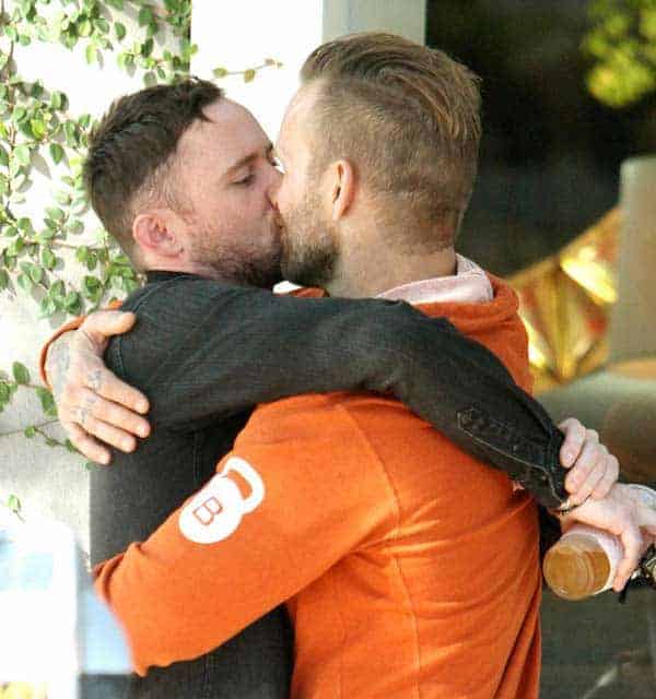 Bob Harper kissing his partner Anton with tight hug