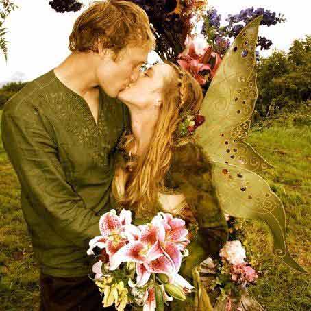 Eve Kilcher kissing her husband holding flowers