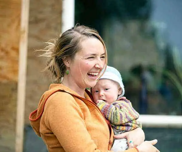 Eve Kilcher holding her son Findlay in her arms happily