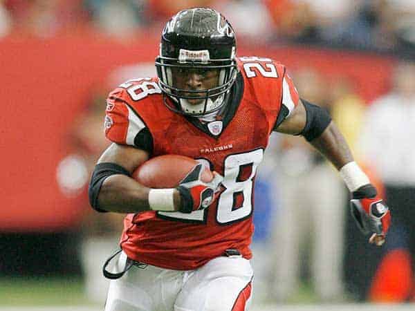 Atlanta Falcons running back Warrick Dunn is a fast runner football player