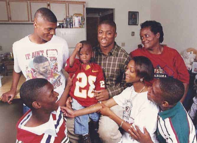 Happy family picture of Warrick Dunn with his siblings