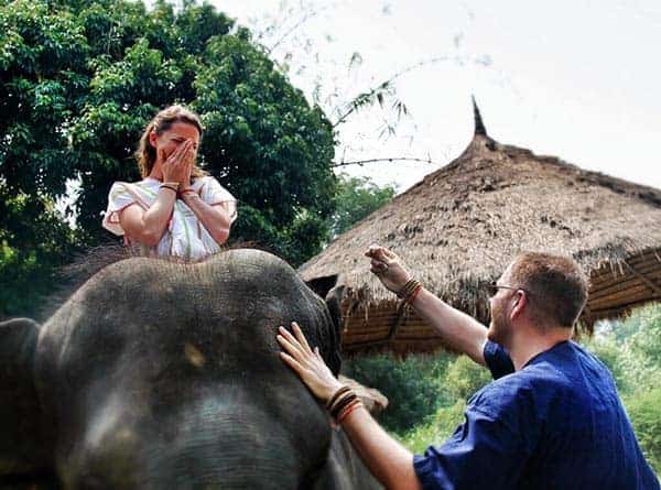 Josh Gates Is Assisting Hallie Gnatovich While Riding Elephant ,