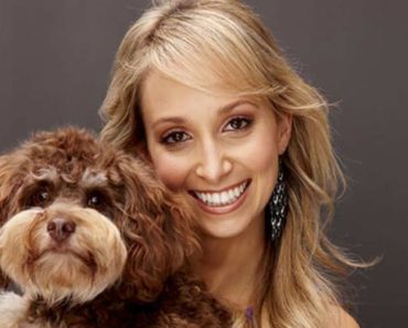 Lisa Chimes posing with adorable dog