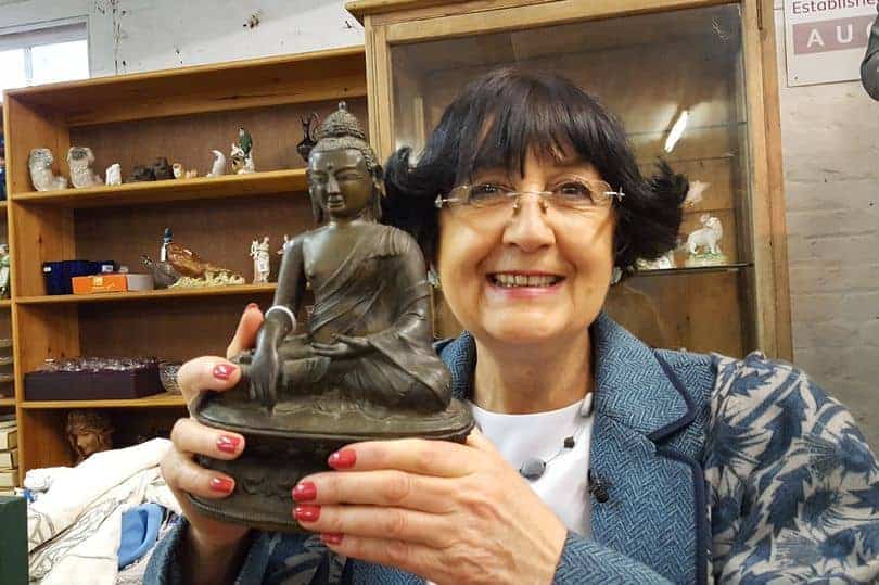 Anita Manning with Buddha statue