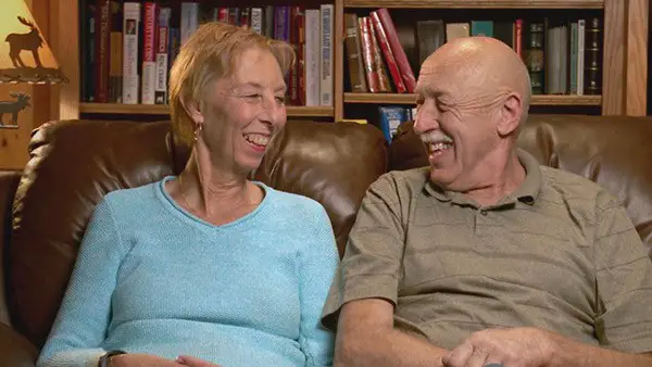 Diane Pol with husband Dr. Jan Pol sitting in a sofa