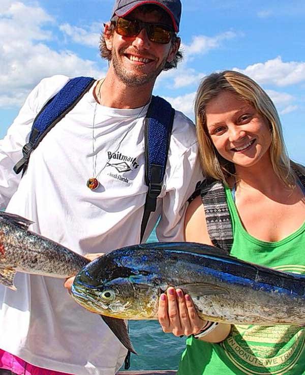 Tyler McLaughlin & his wife Savannah Tarpley with fish the caught
