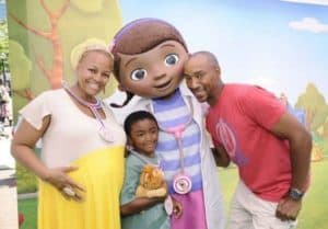 Image of Kim Fields with her husband and kid