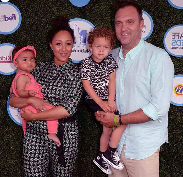 Image of Adam Housely with her husband Tamera Mowry, and with their kids