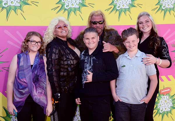 Image of Beth Smith with her husband Duane Chapman and with their kids