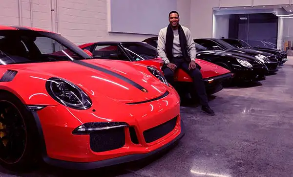 Image of Michael Stragan with his cars collection