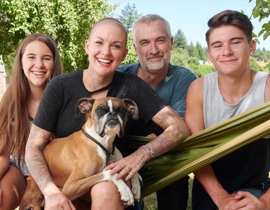 Image of Amanda Giese with husband Gary Walters and their two children.